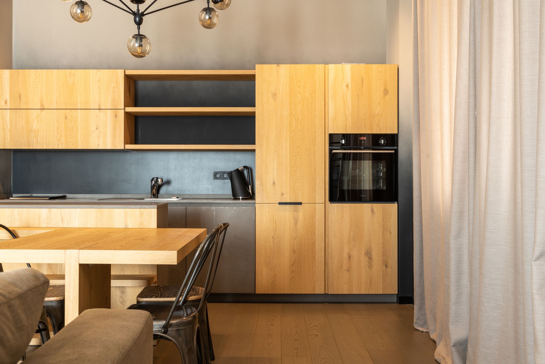 A completed kitchen renovation with an island and modern cabinetry
